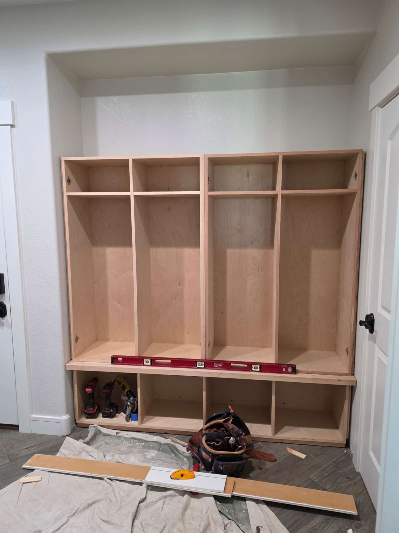 Built-in mudroom locker unit under construction, showing the joinery before finishing