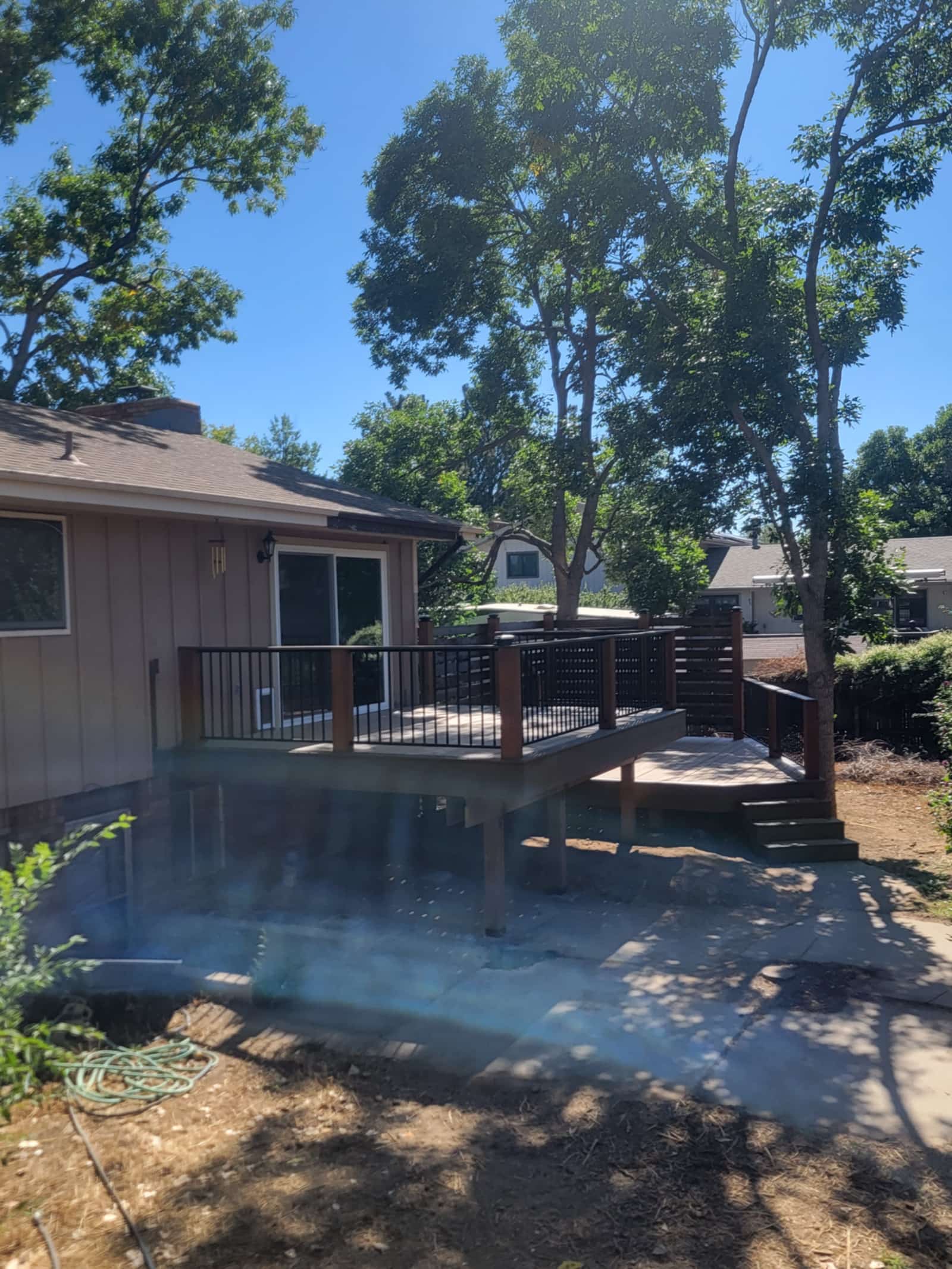 Cedar deck with horizontal slat privacy screens and integrated bench seating